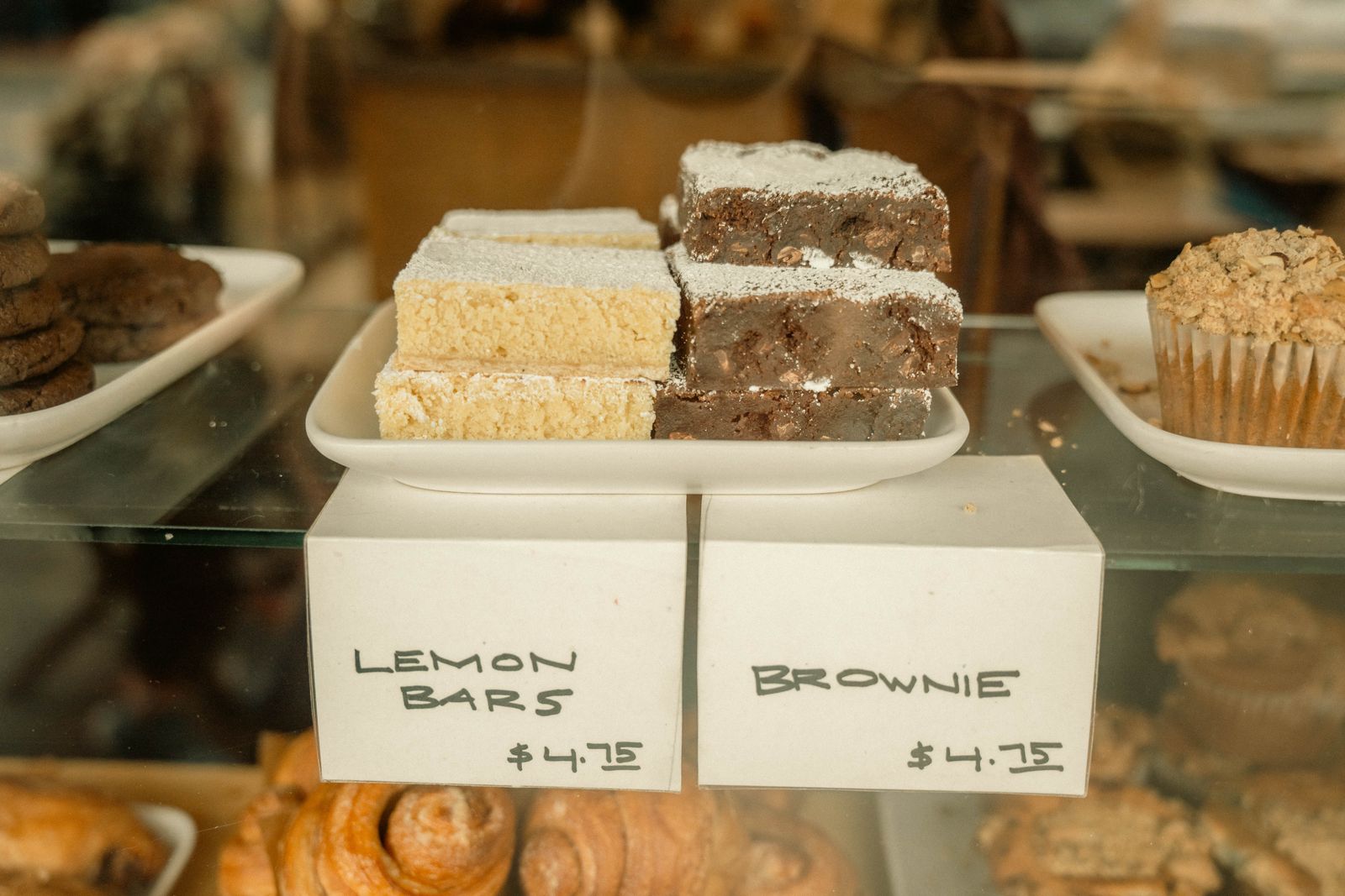 a pastry case with croissants and scones